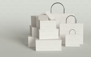 Una pila di scatole bianche con un manico nero