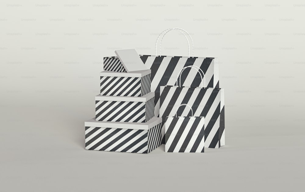 a stack of black and white bags sitting on top of each other