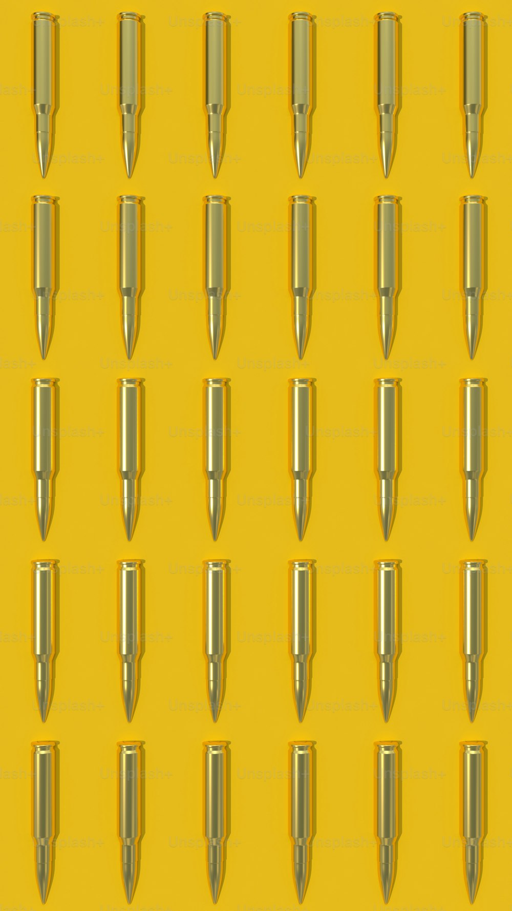 uno sfondo giallo con un mucchio di oggetti simili a proiettili