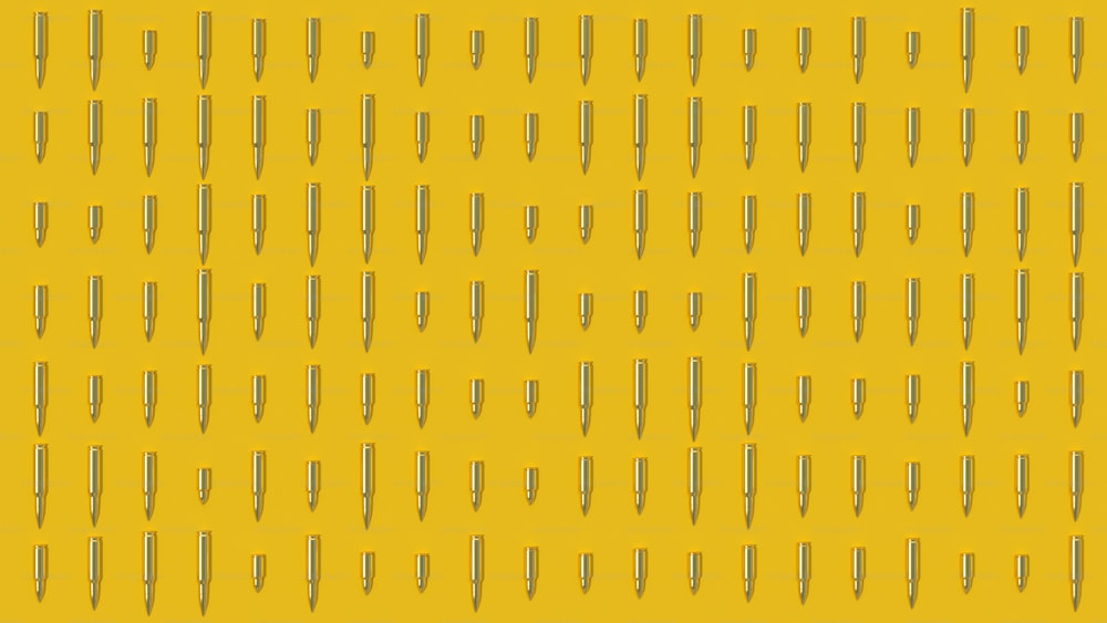 a yellow background with a bunch of pins on it
