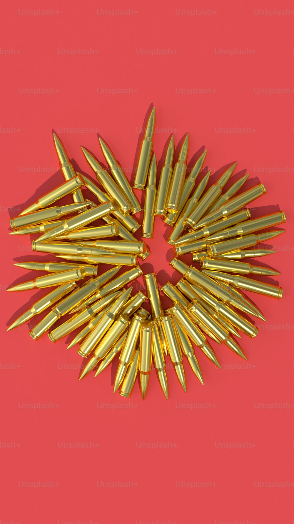 a bunch of bullet shells on a pink background
