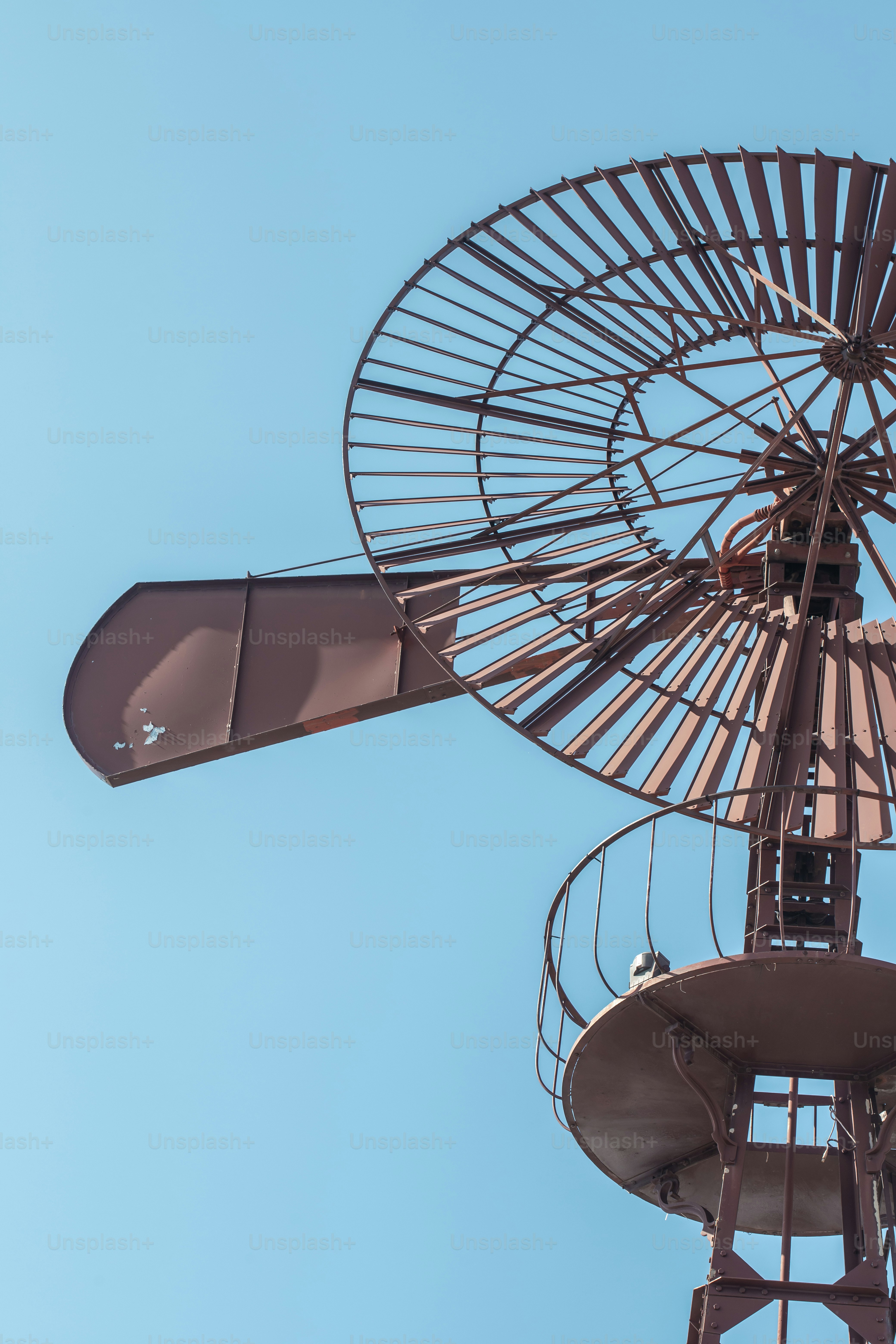 a large metal object with a blue sky in the background