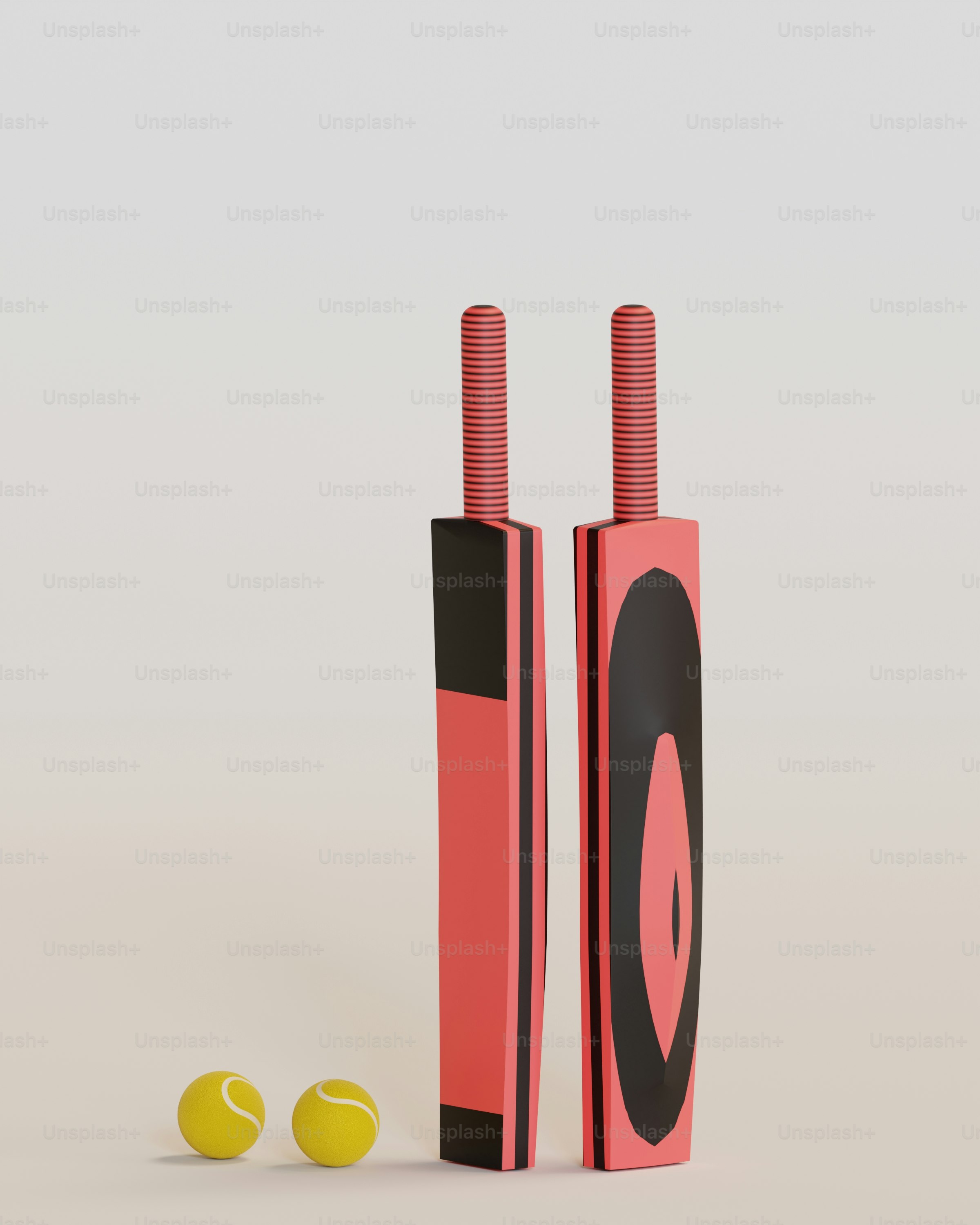 une paire de tubes rouges et noirs avec des balles de tennis