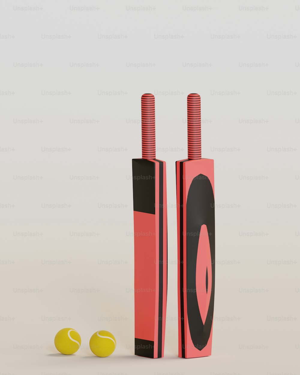 a pair of red and black tubes with tennis balls