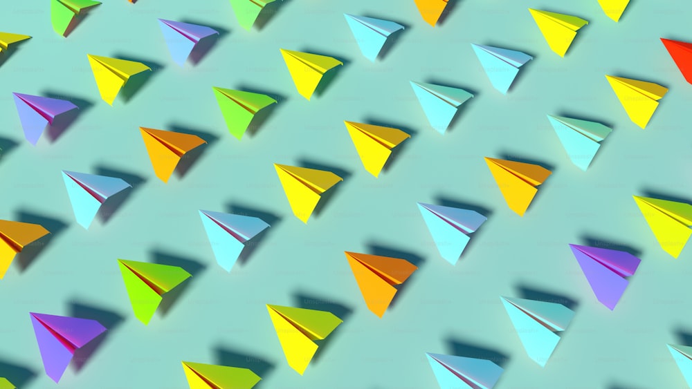 a group of colorful paper airplanes on a blue background