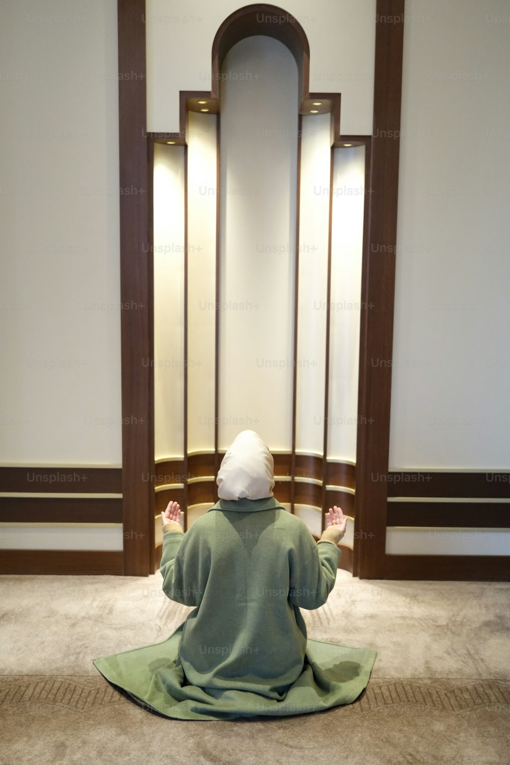 a person sitting on a rug in a room