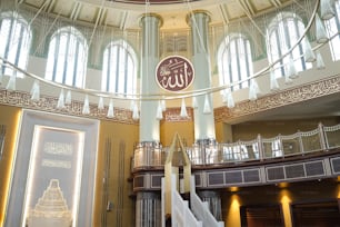 the inside of a building with a clock on the wall