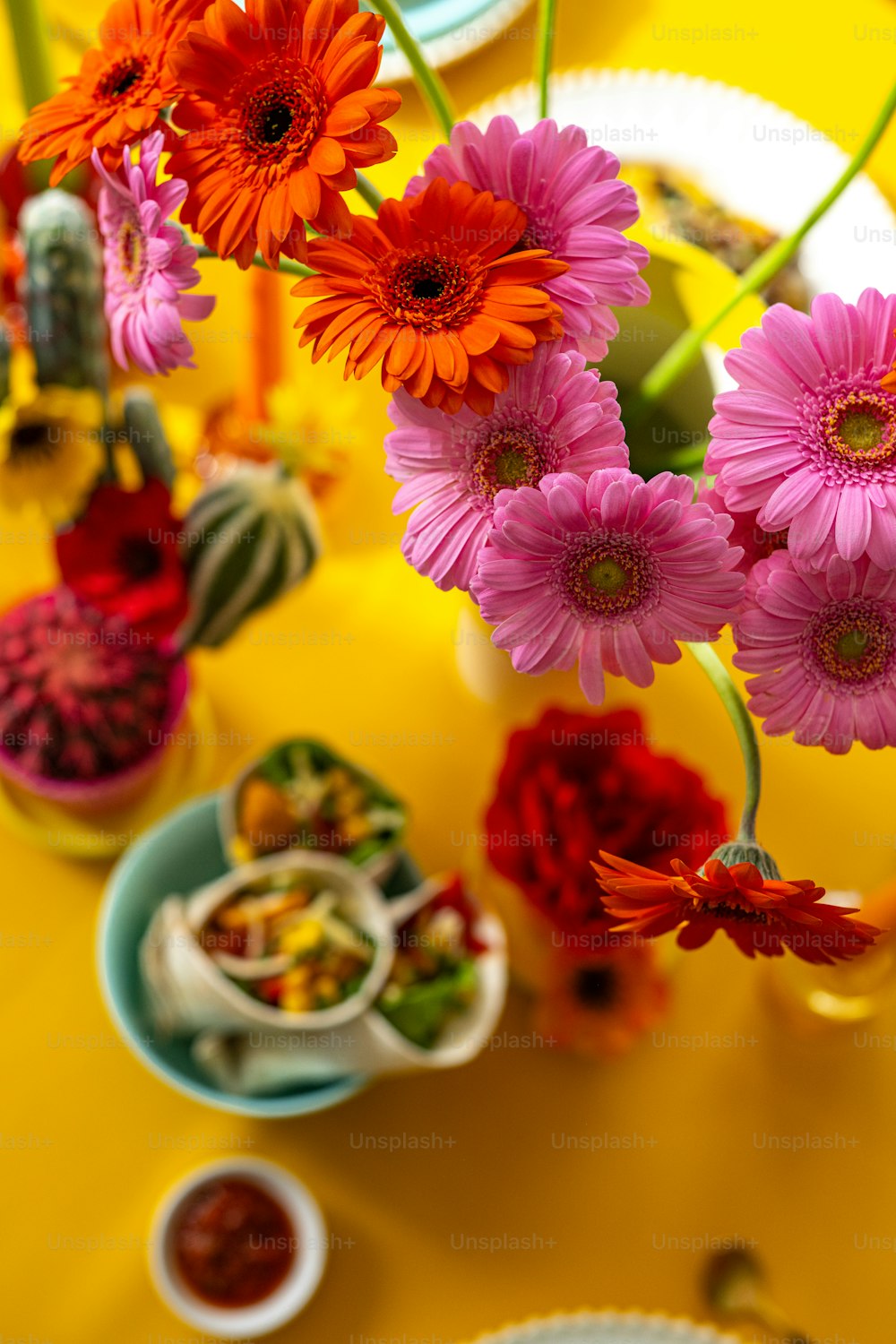 a bunch of flowers that are sitting on a table