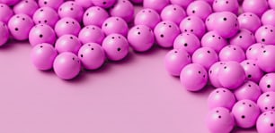 Eine Gruppe rosa Kugeln mit Löchern in der Mitte