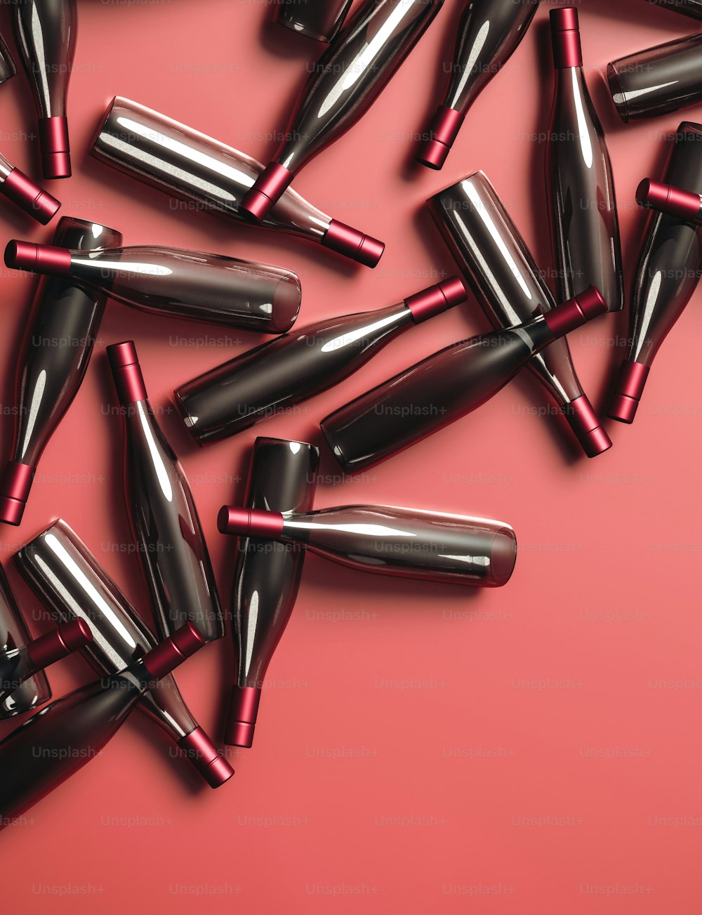 a group of black and red lipsticks on a pink background