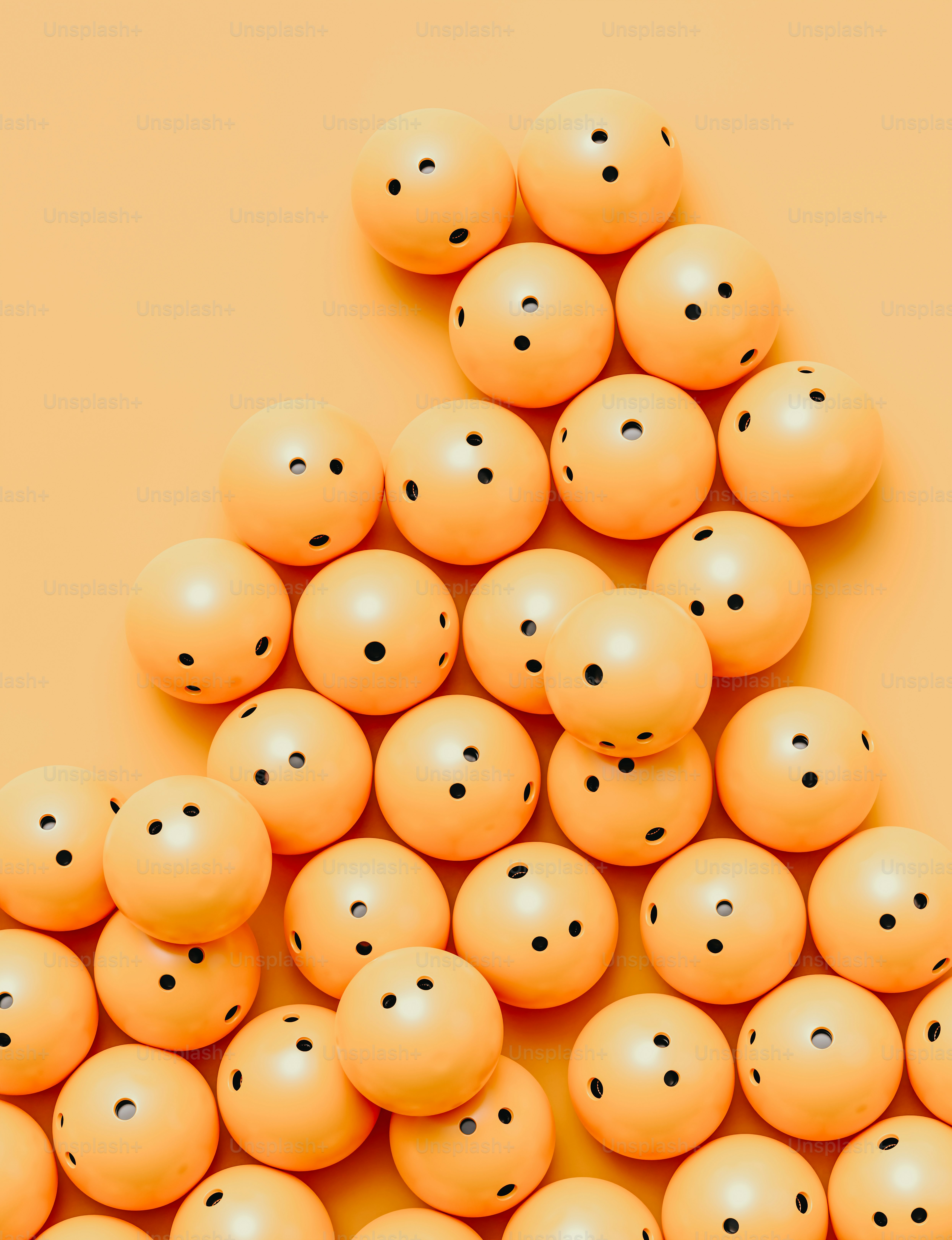 a pile of orange balls sitting on top of a table
