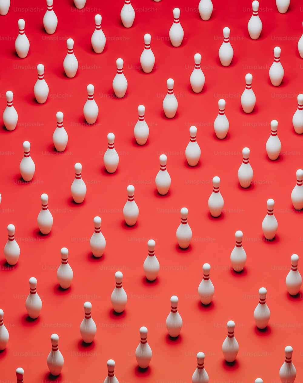 a large group of small white objects on a red background