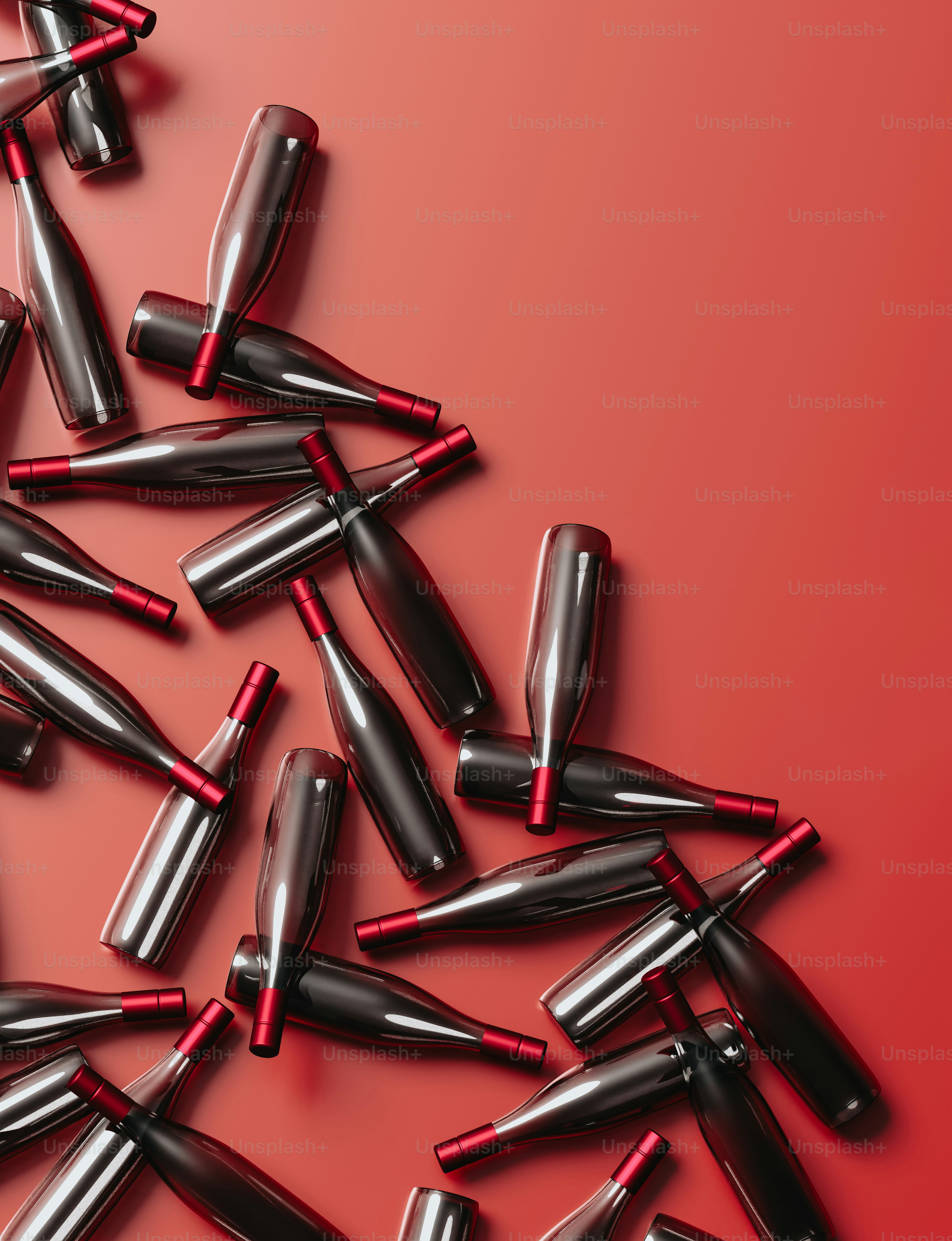a pile of red and black lipstick on a red background