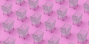a group of shopping carts sitting on top of a pink floor