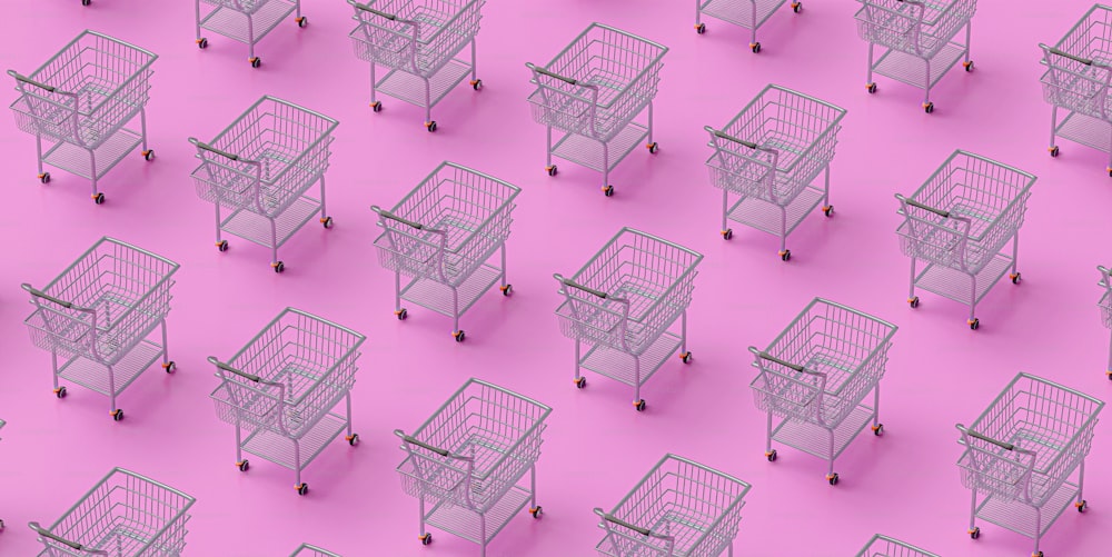 a group of shopping carts sitting on top of a pink floor