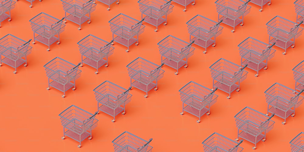 オレンジの背景にショッピングカートのグループ