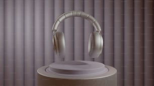 a pair of headphones sitting on top of a speaker