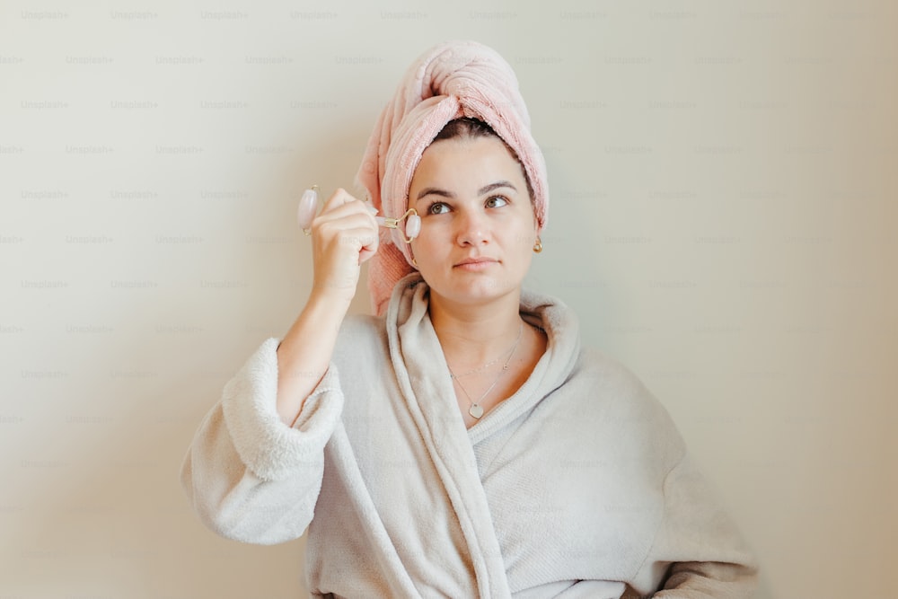 a woman with a towel wrapped around her head