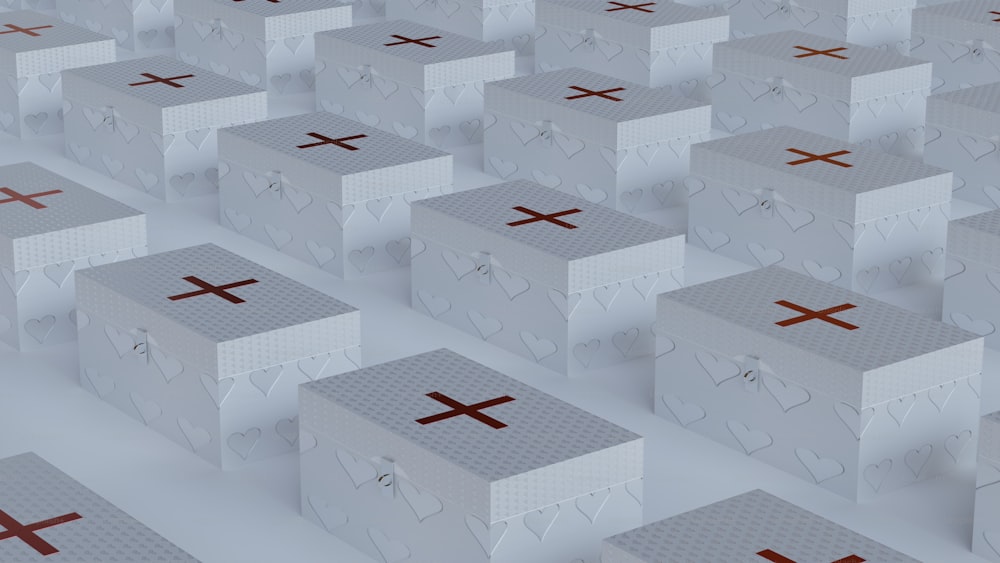 a large group of white boxes with crosses on them
