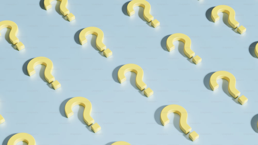 a group of yellow question marks on a blue background