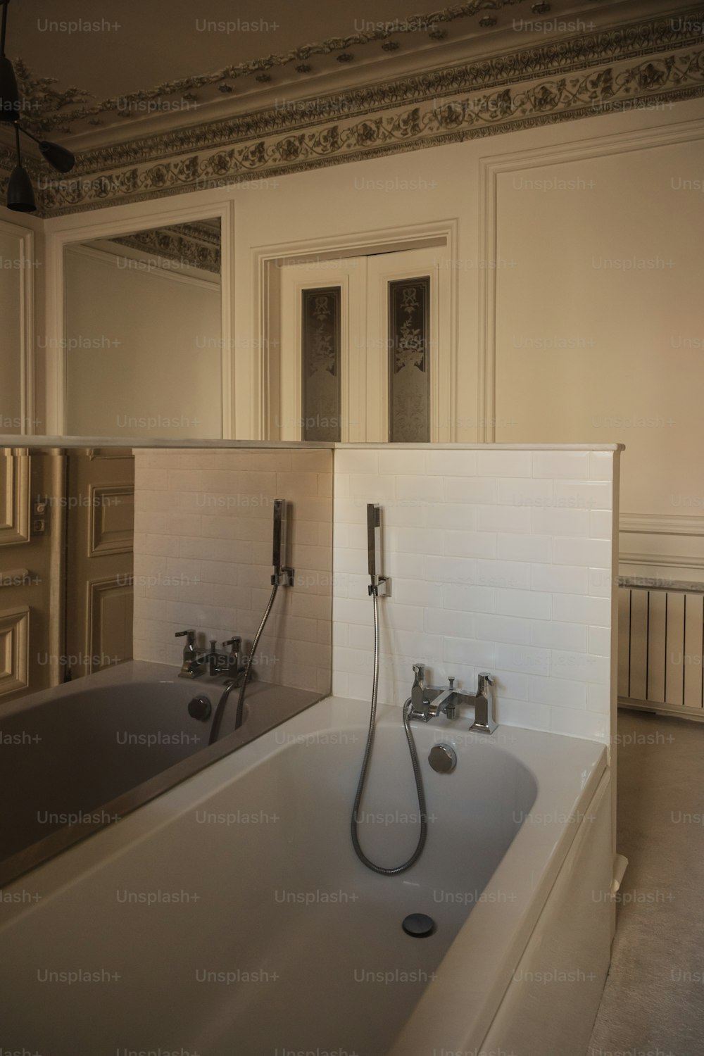 a bathroom with a bathtub and a mirror
