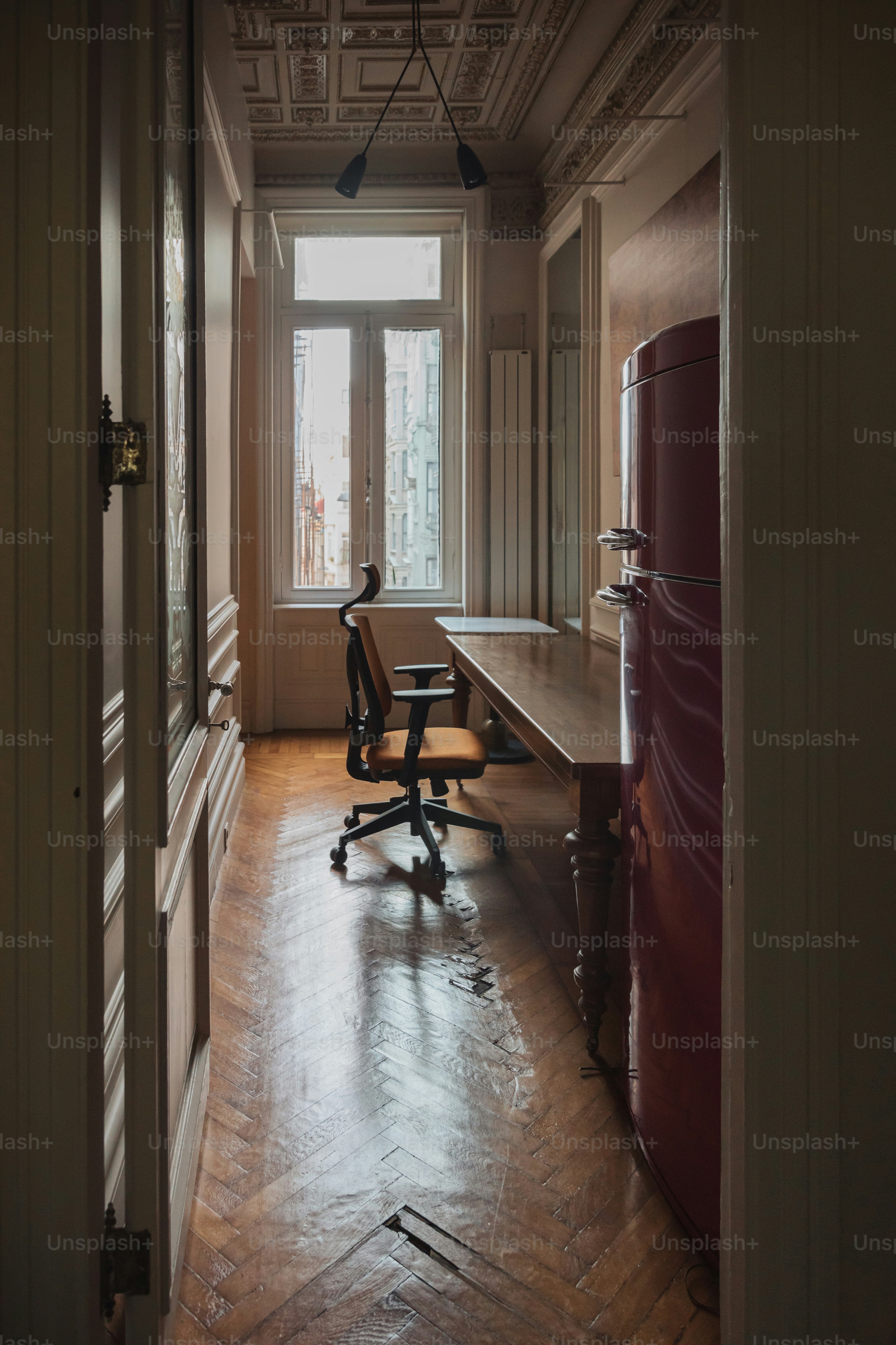 a room with a desk and a chair in it