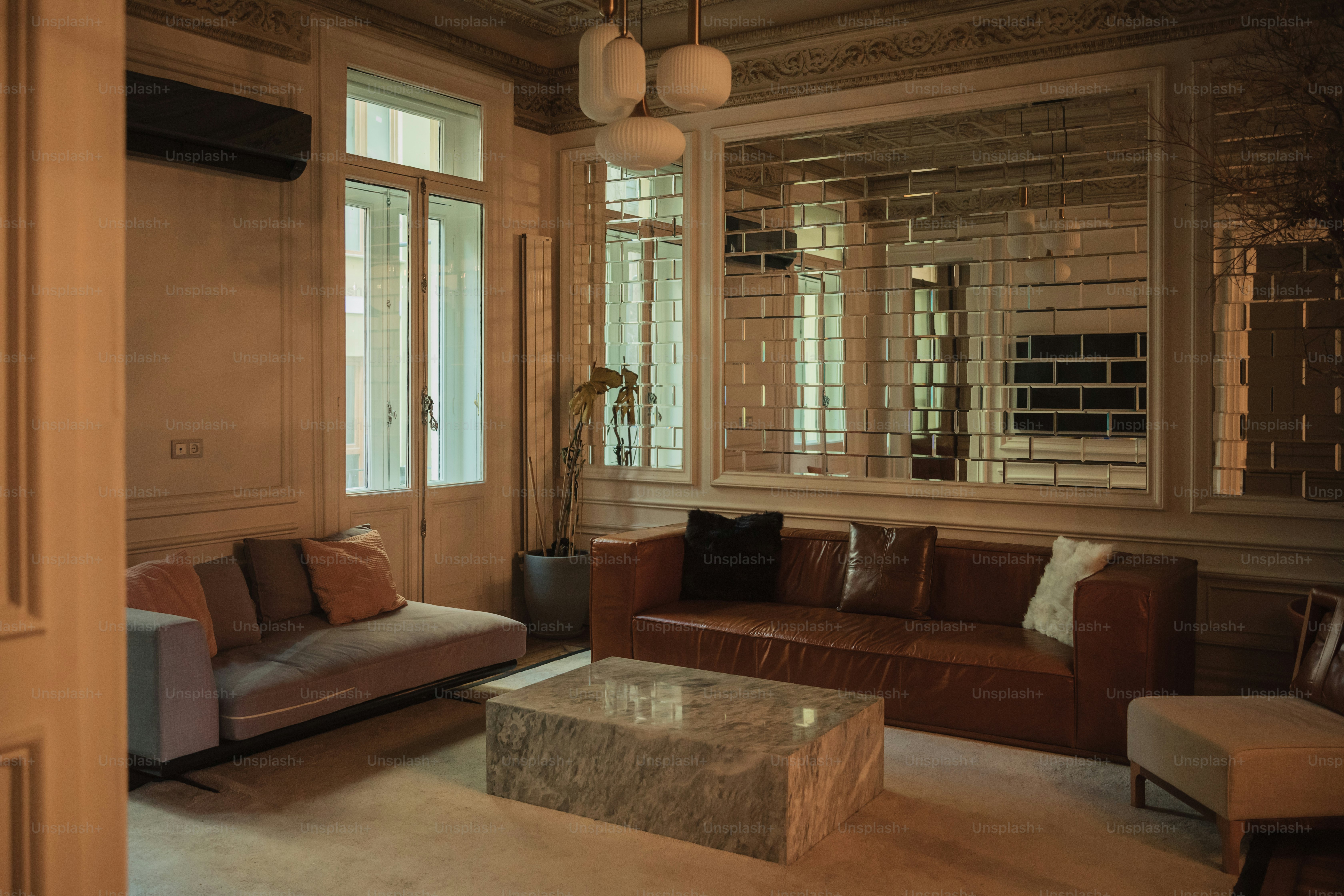 a living room filled with furniture and a large window