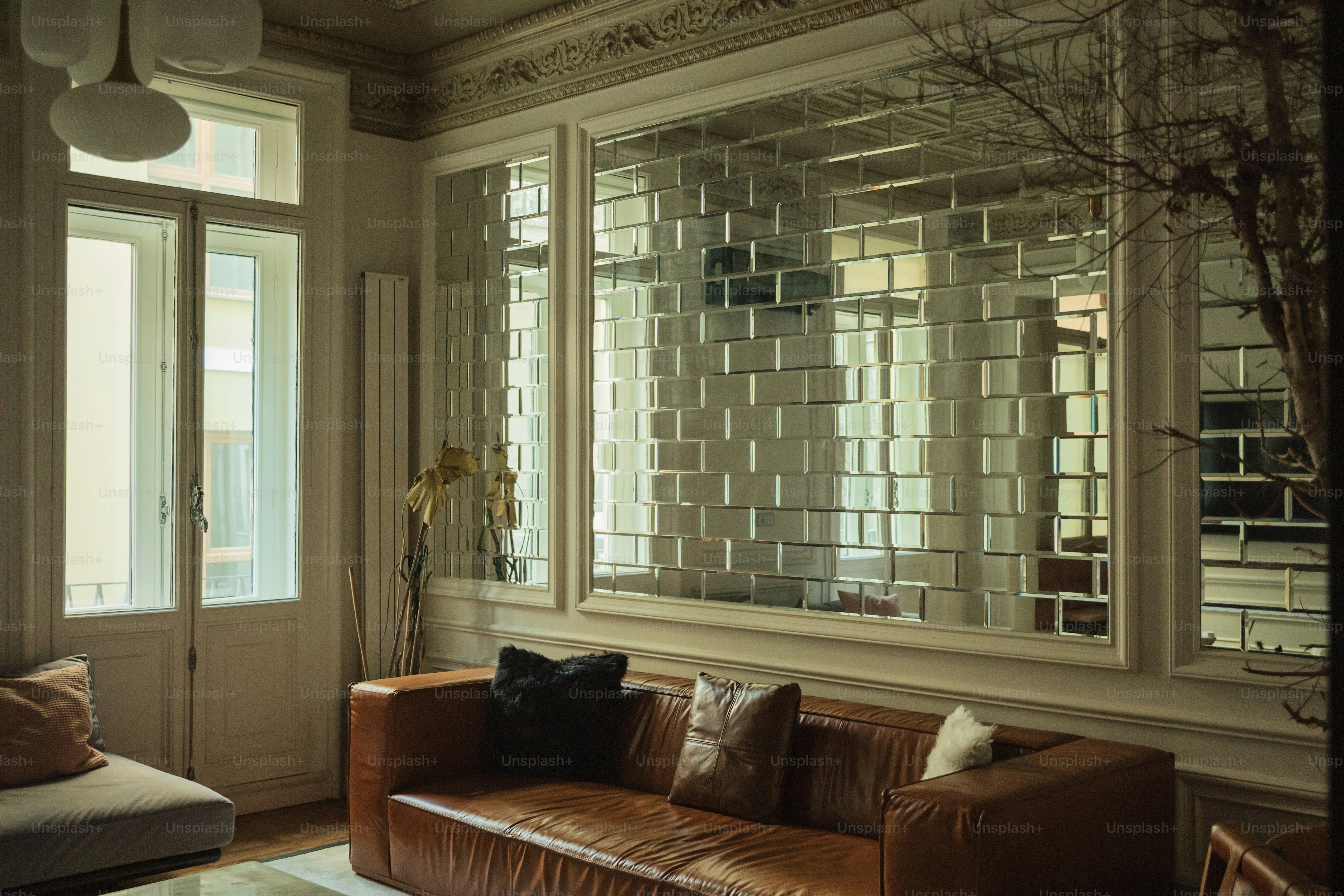 a living room filled with furniture and a large window
