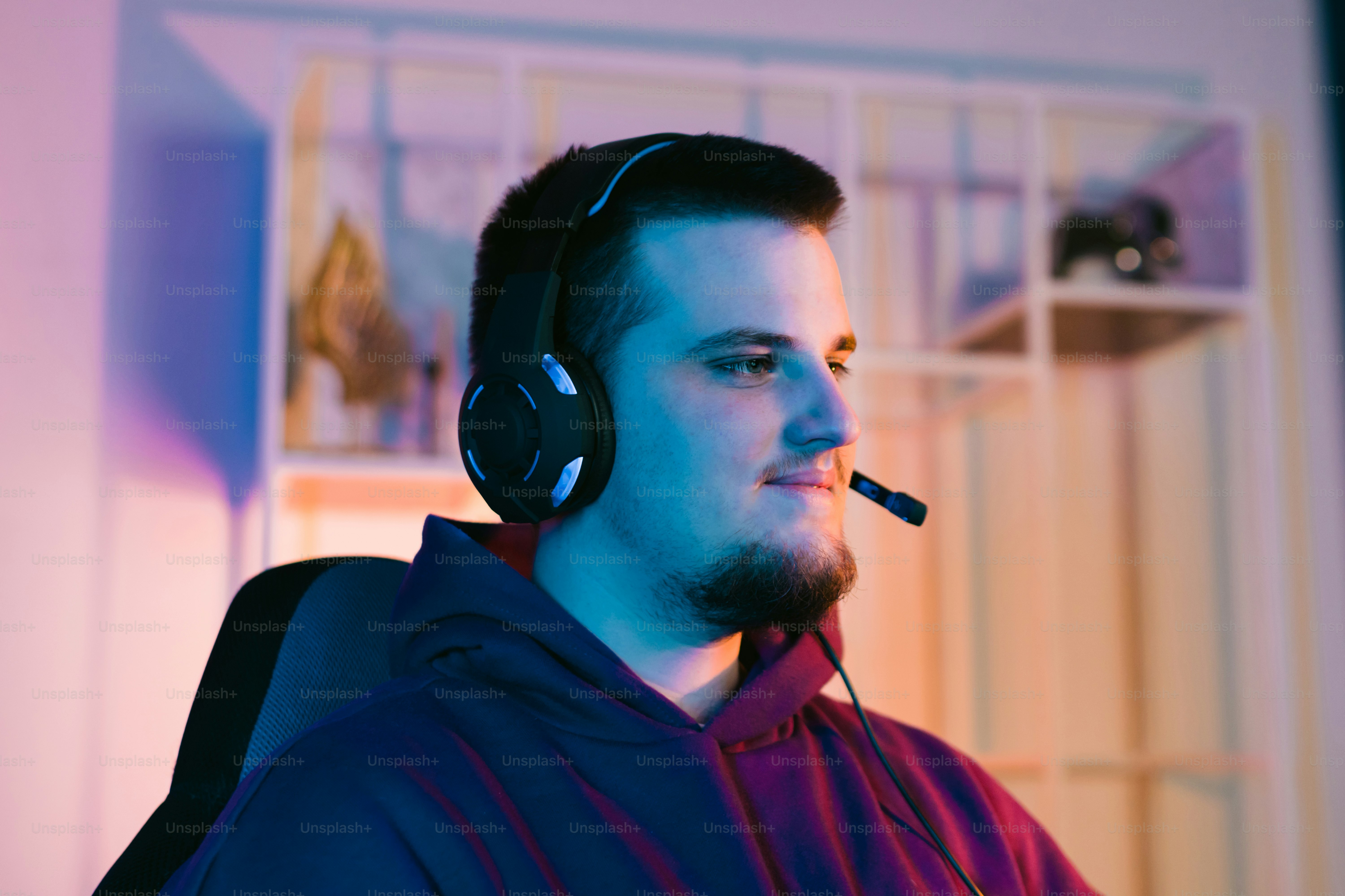 a man wearing headphones and a hoodie