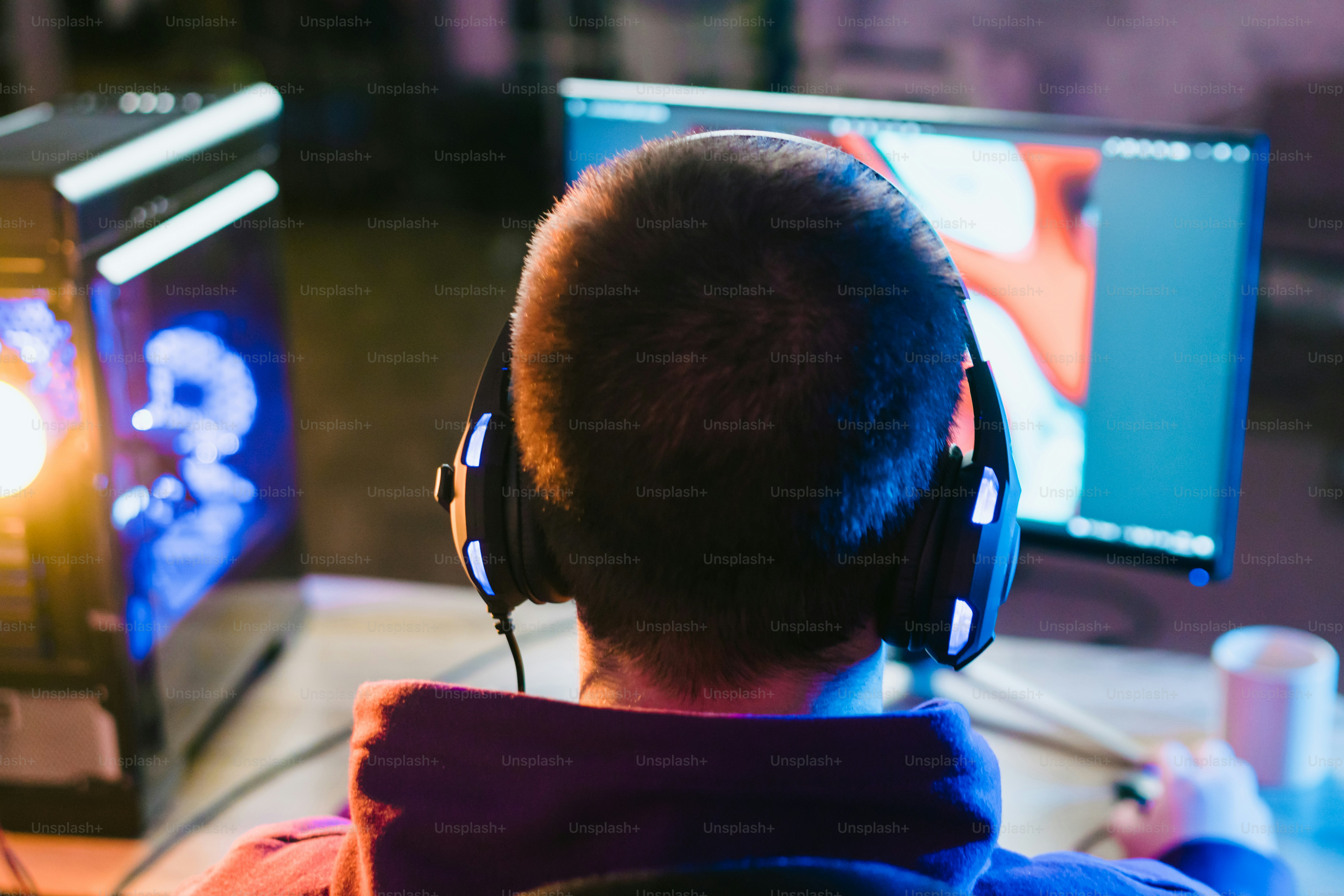 child with headset, gaming on his PC