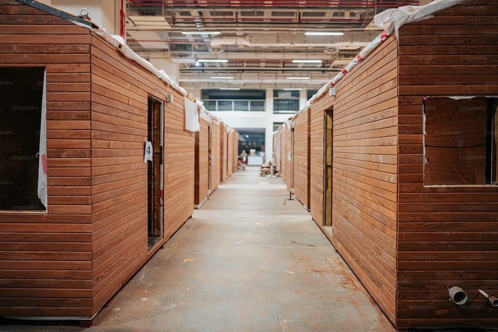 a row of wooden buildings sitting inside of a building