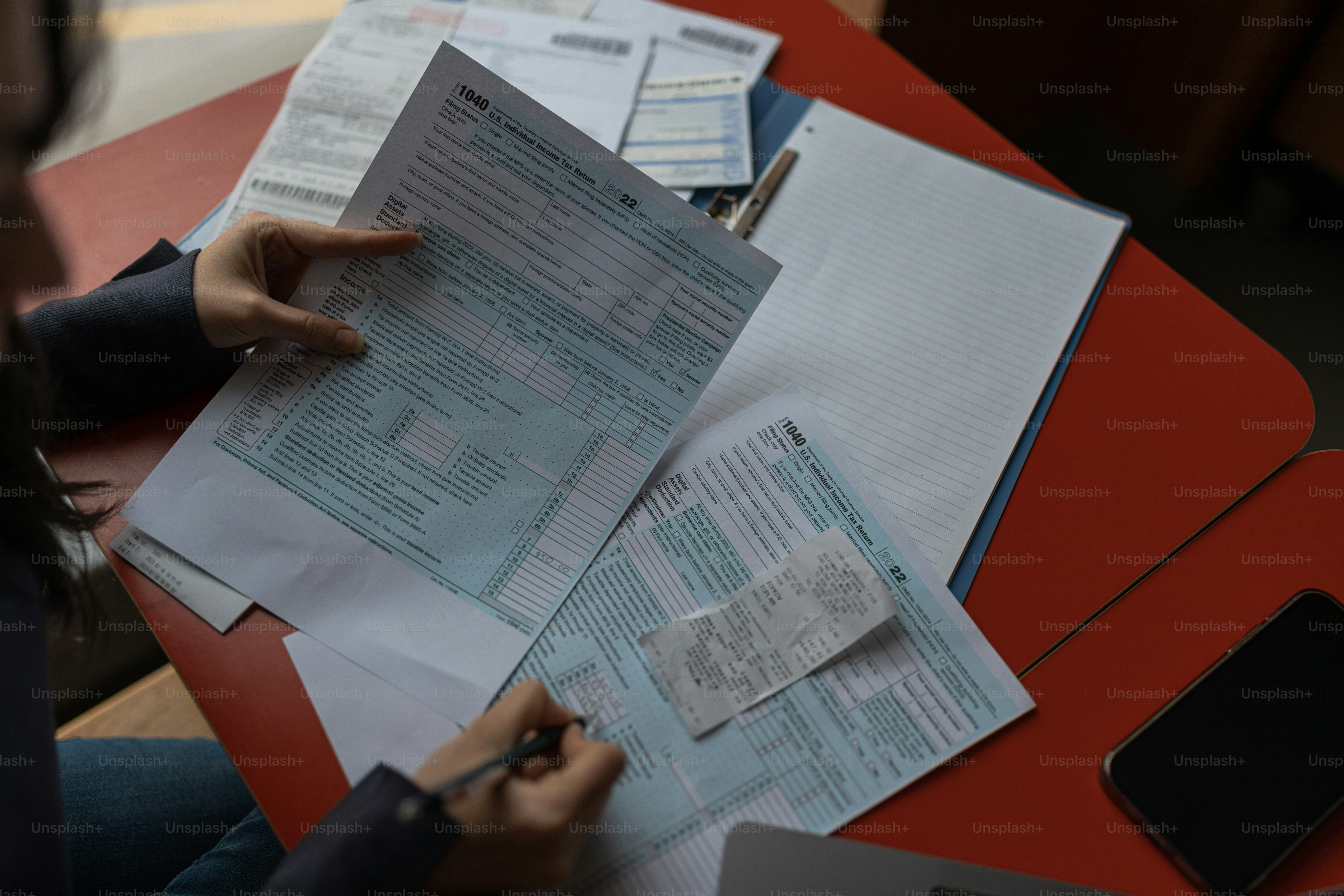 Organizing tax documents on a desk