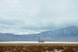 a large body of water with mountains in the background