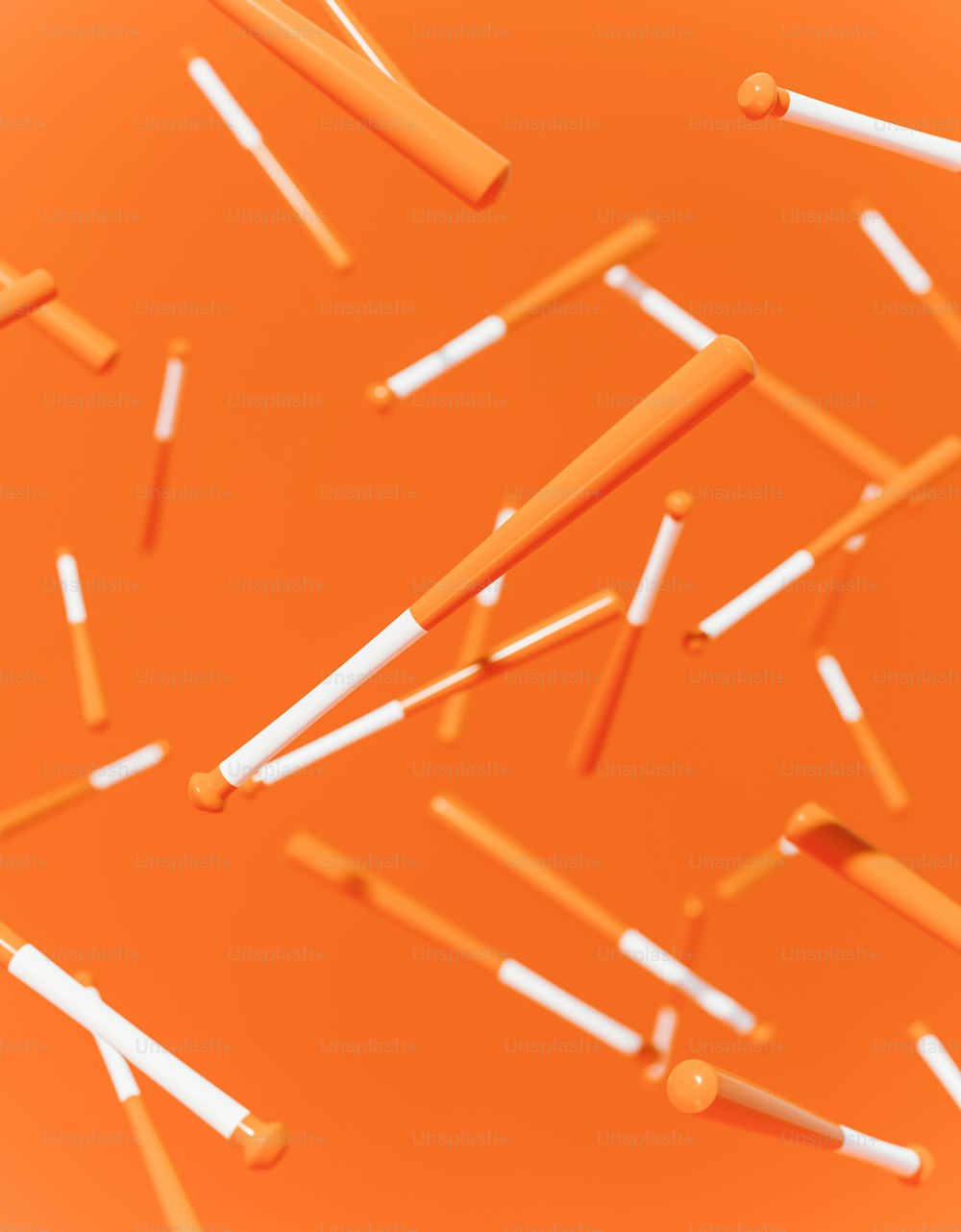 a bunch of orange and white toothbrushes on an orange background