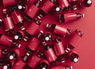 a pile of red batteries on a red background