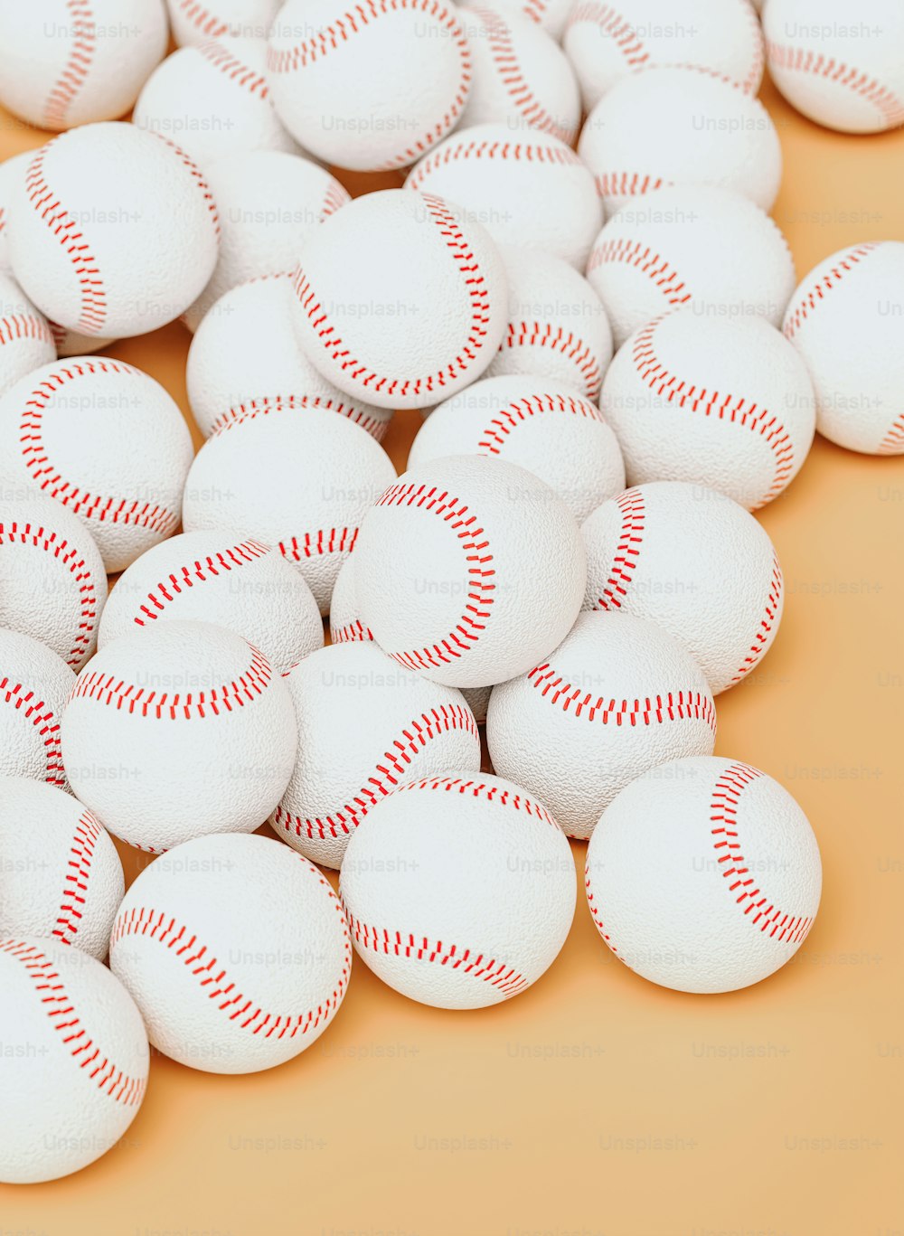 a pile of baseballs sitting on top of a table