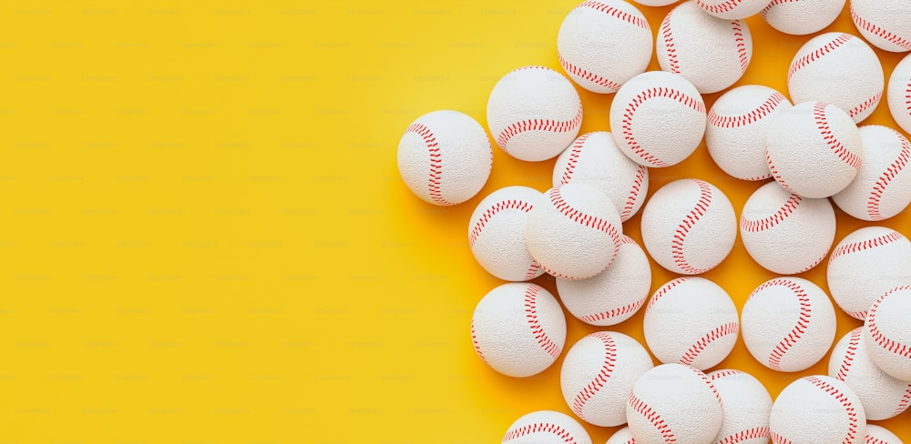 a pile of white baseballs on a yellow background