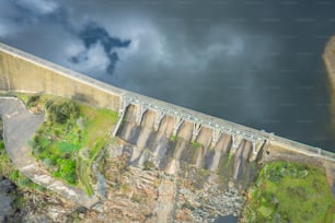 an aerial view of a dam and a road