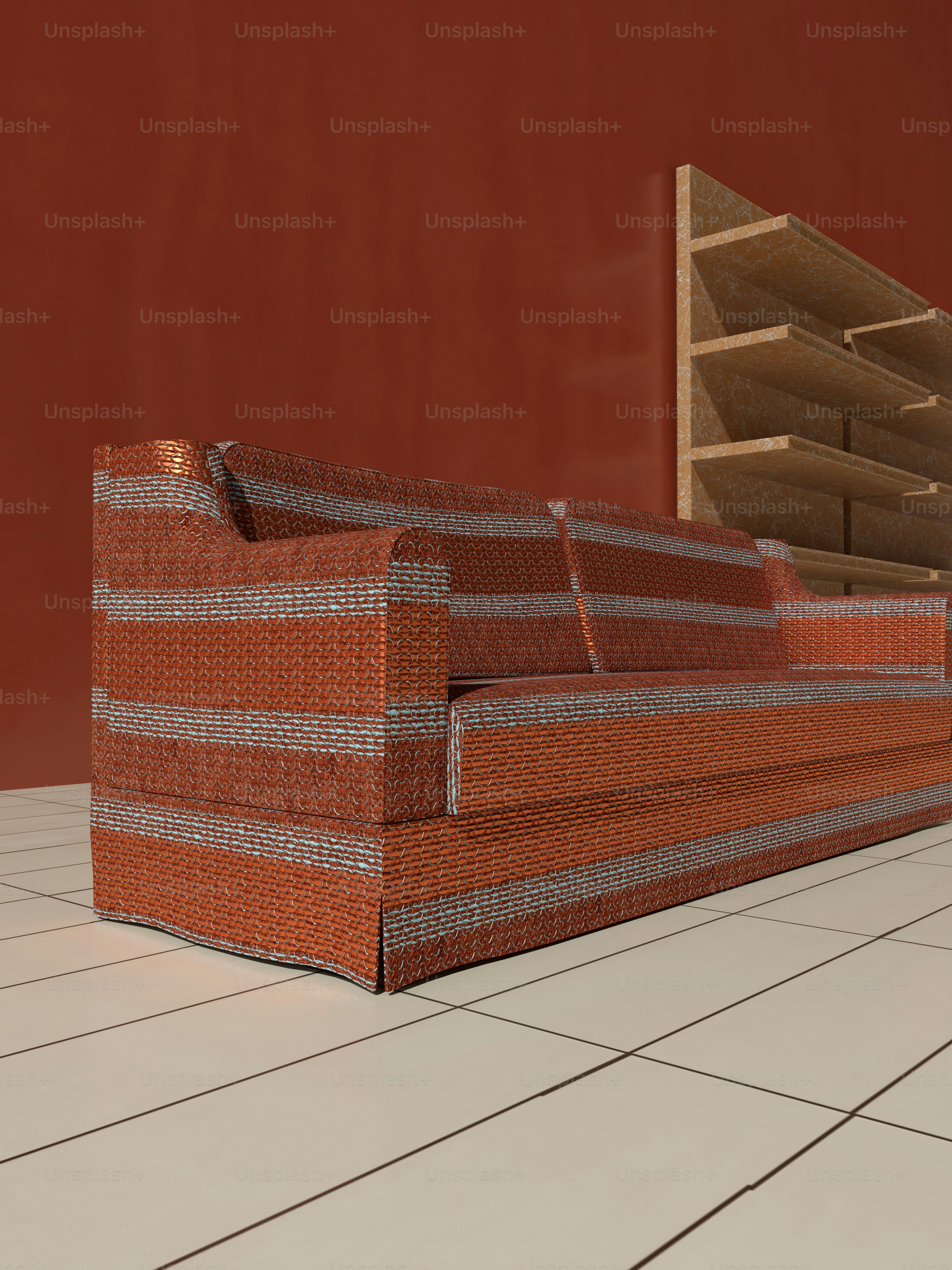 a couch sitting on top of a white tiled floor
