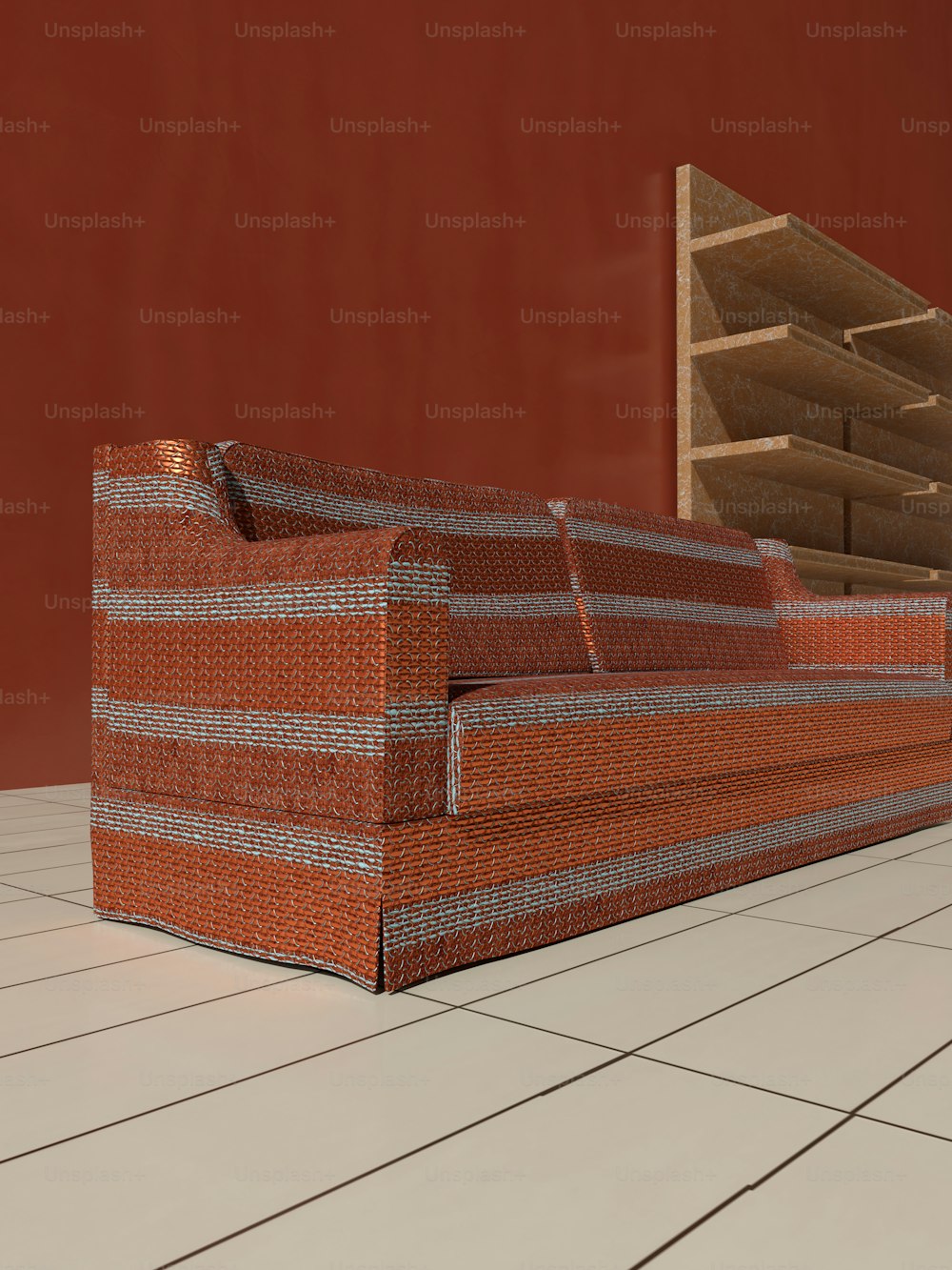 un sofá sentado encima de un piso de baldosas blancas