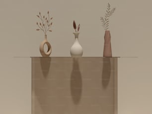 a group of three vases sitting on top of a table