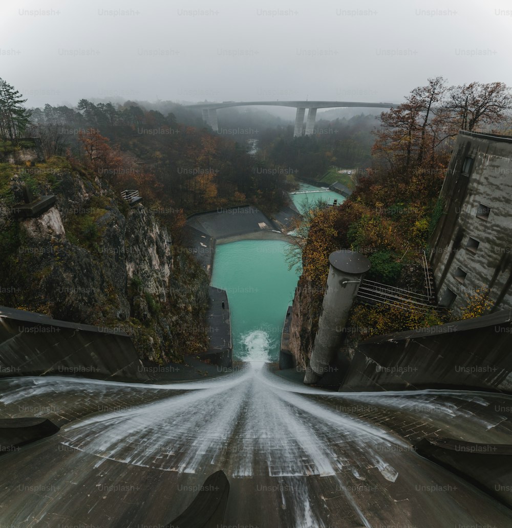 a view of a river with a bridge in the background