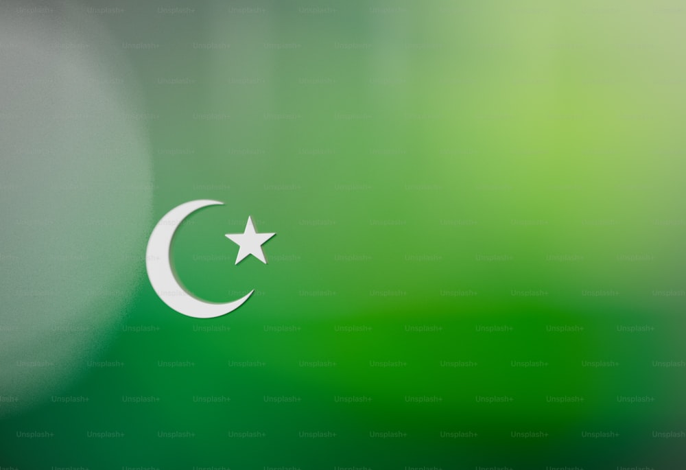 a white crescent and star on a green background