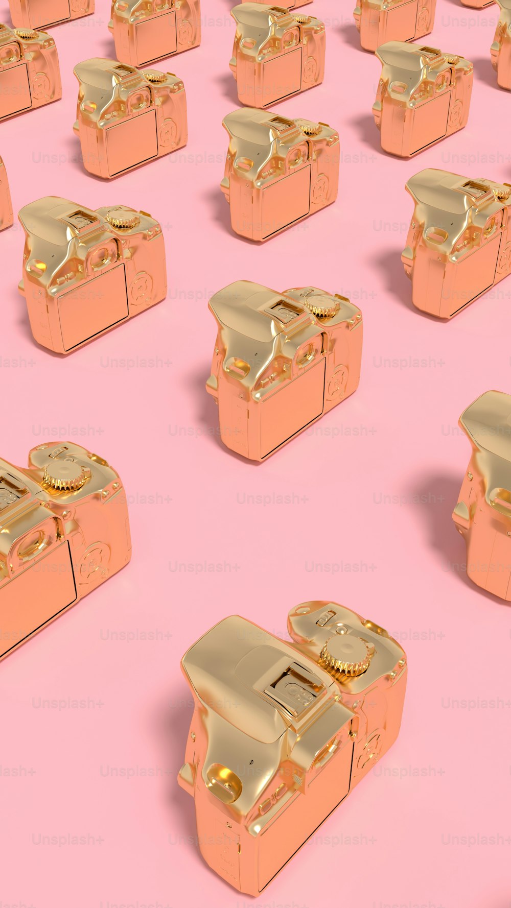 a bunch of gold objects on a pink background
