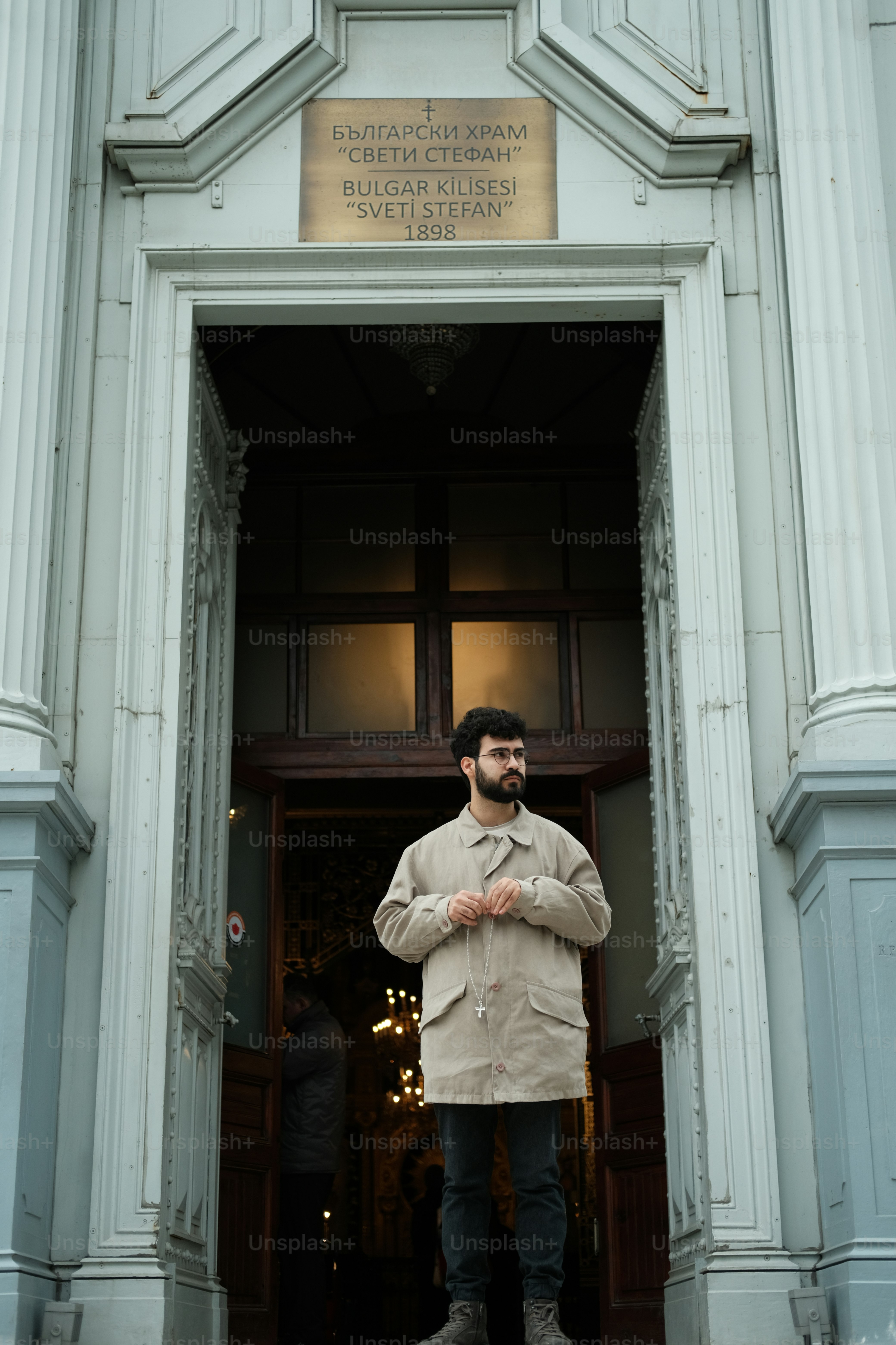 a man standing in the doorway of a building