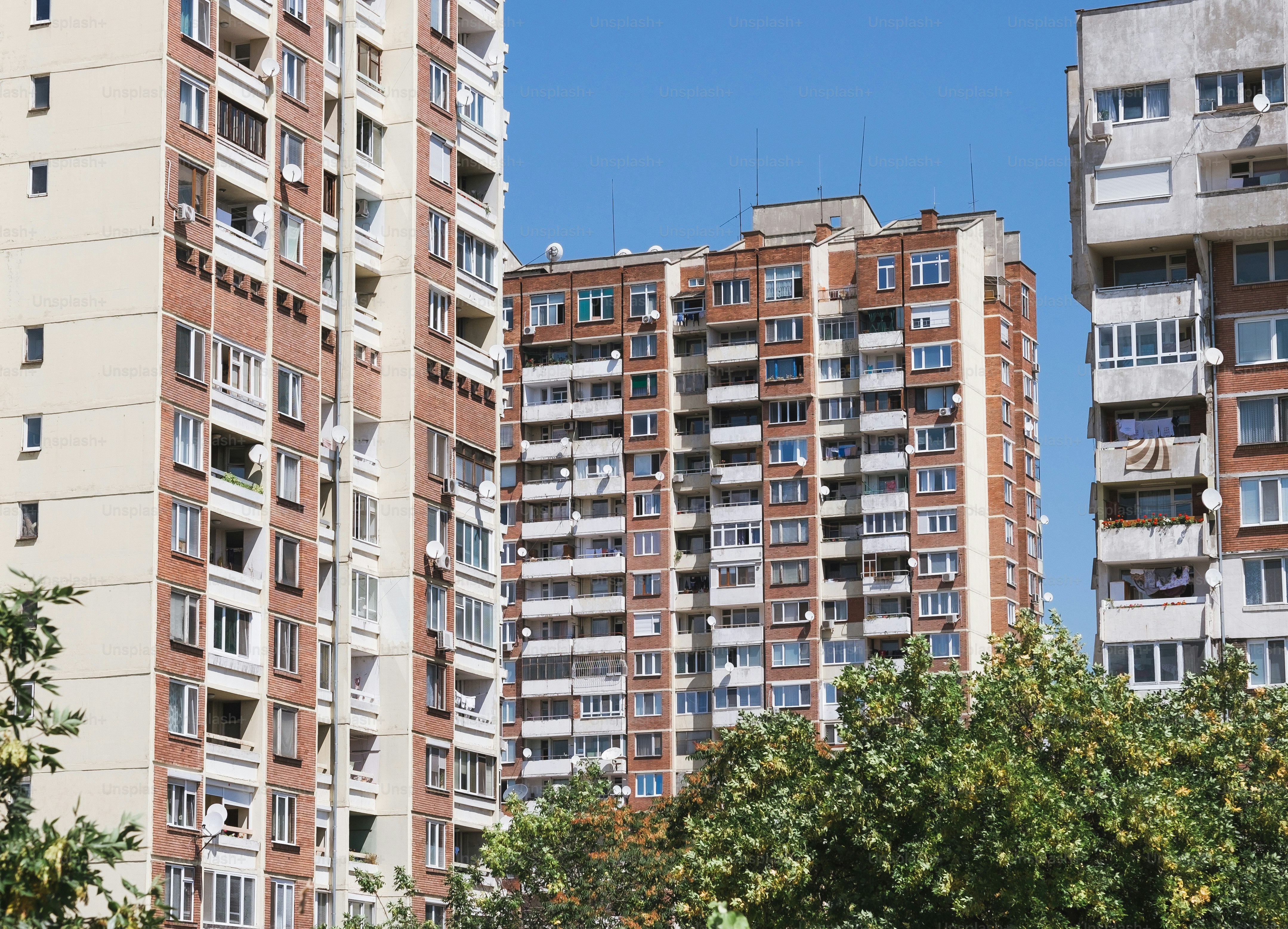 a couple of tall buildings sitting next to each other