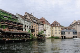 a river runs through a row of buildings