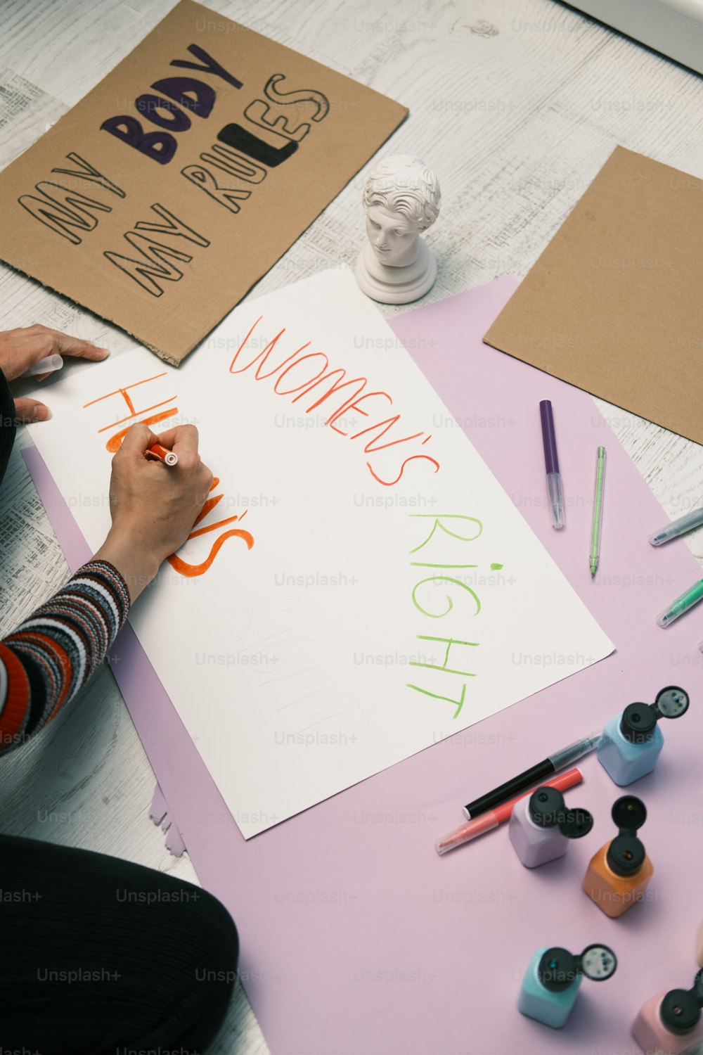 a person is writing on a piece of paper