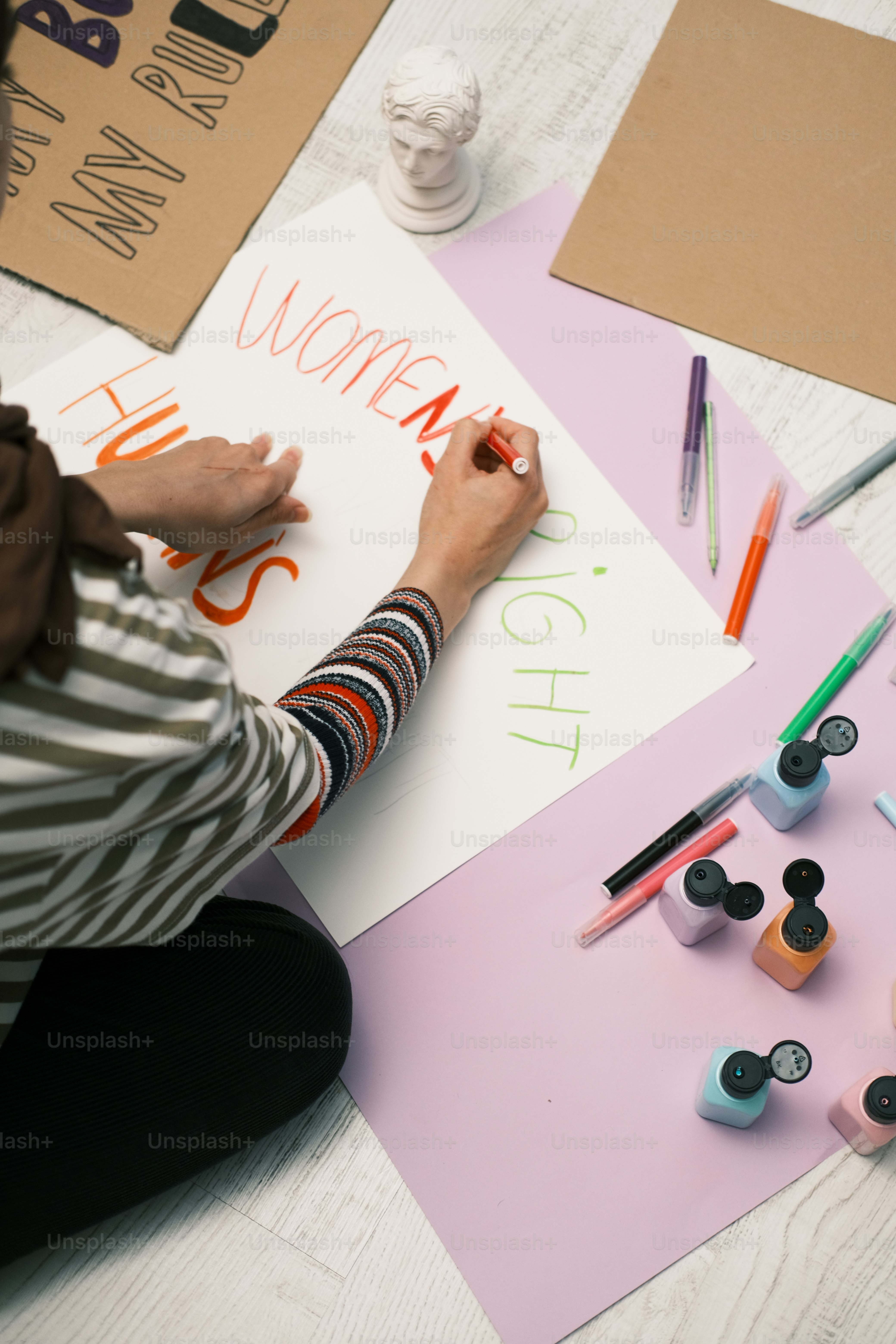 a person is writing on a piece of paper