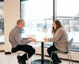 a man and a woman sitting at a table